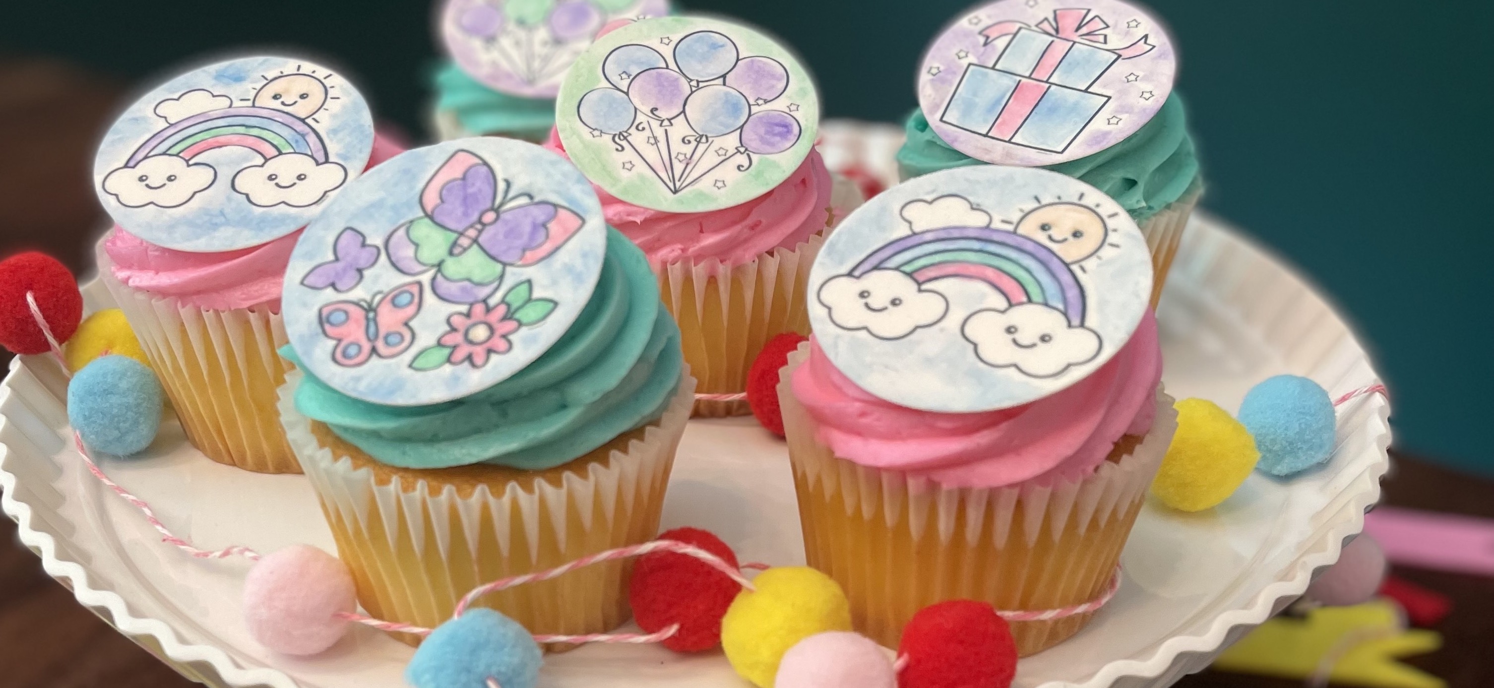 PYO kits paint your own kits on cupcakes. Butterfly and rainbow designs with paint your own paint palettes and paint brush